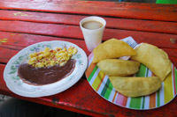 typical Central American breakfast - eggs and beans with fry jacks